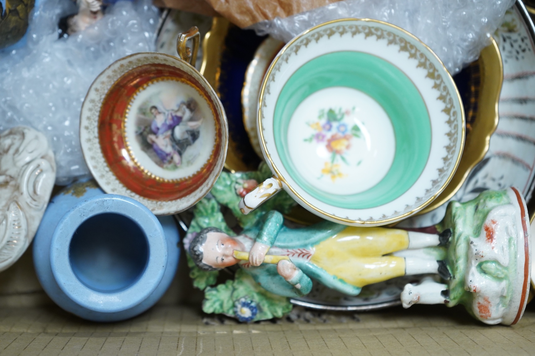 A collection of mixed ceramics including a Dresden figure and cabinet cups and saucers